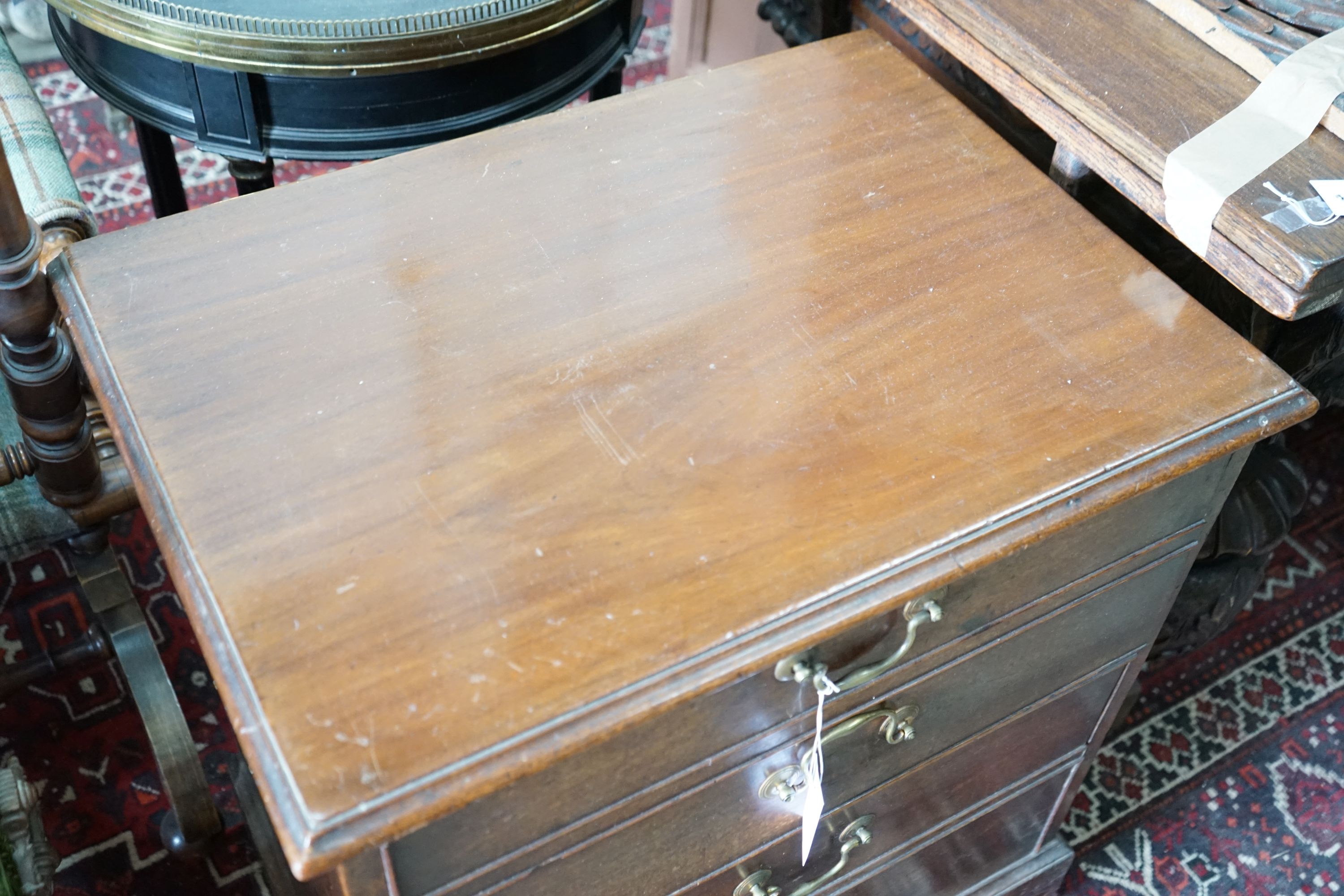 A 19th century mahogany hinge top commode with dummy drawer front, width 65cm, depth 47cm, height 71cm